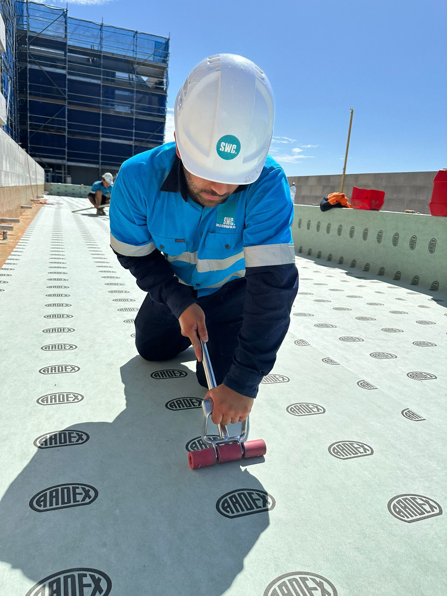 Staples Waterproofing Co. applying membrane on site